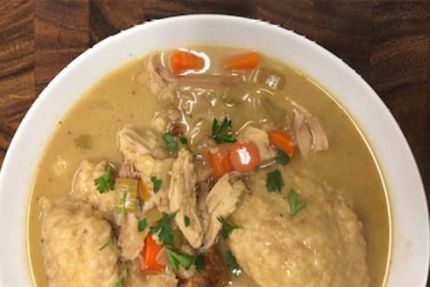 A bowl of chicken and dumplings
