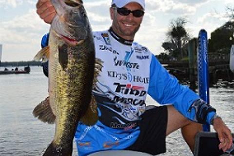 Howell on his boat with his biggest bass by Howell on his boat with his biggest bass...