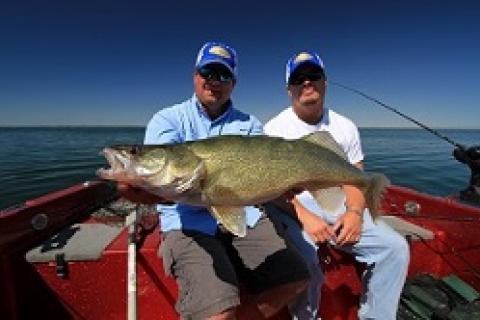 The author Jason Mitchell and friend Ken Schmidt with a massive Fort Peck walleye.  Repetition is a top strategy to trip the trigger of late summer walleye by The author Jason Mitchell and friend Ken ...