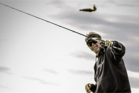 Angler Wade Middleton casting out a fishing lure