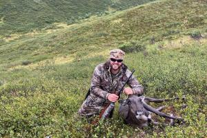 hunter with small  caribou
