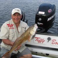 Fishing Pro Tony Puccio Holding a Nice Red Fish