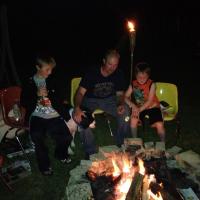 Cooking Marsh Mellows Over the Camp Fire